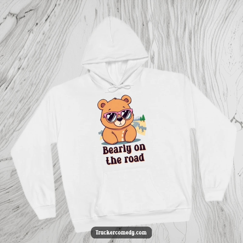 Funny Bear Hoodie: A bear sporting oversized sunglasses peers at a winding road, showcasing a humorous travel vibe.