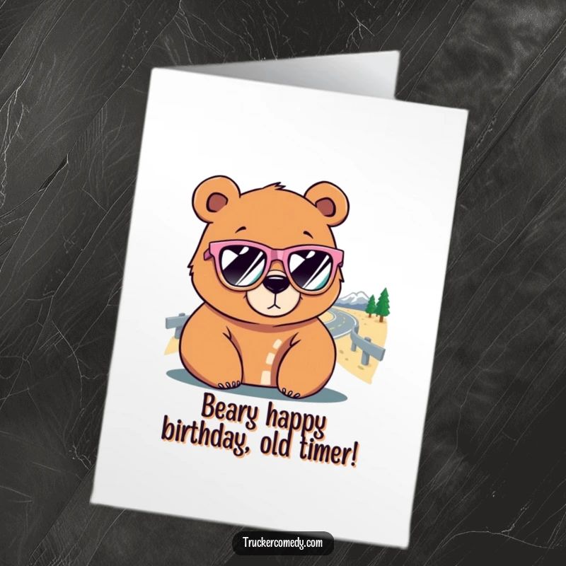 Funny Free Printable Birthday Card: Cool bear in sunglasses stares at winding road, ready for adventure.